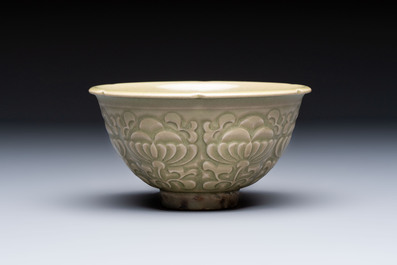 A Chinese carved Yaozhou celadon-glazed bowl with floral design, Jin