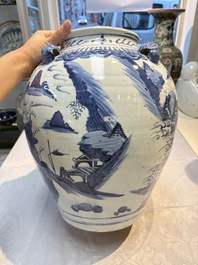 A Chinese blue and white 'Mountainous Landscape' vase with four lion-form handles, 16/17th C.