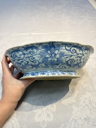 Four Chinese blue, white and famille rose tazzas and a covered spice bowl with bats design, 19th C.