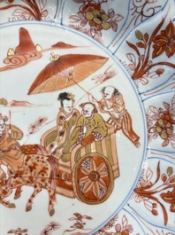 A Chinese iron-red and gilt-decorated dish with a courtly carriage scene, Kangxi