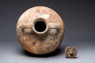 A Roman pottery olive oil transport amphora with original cover, South of Spain, 1st/3rd C.