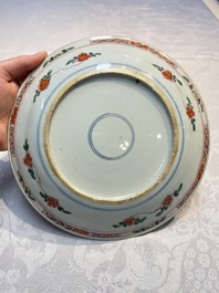 A pair of Chinese famille verte 'Ladies in a Garden' plates, Kangxi
