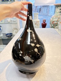 A Chinese black-glazed reverse-decorated bottle vase, 20th C.