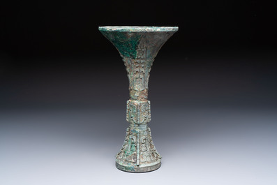 A Chinese archaic bronze wine vessel with Taotie design, Gu 觚, Shang