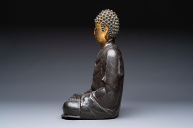A large Chinese gilt-lacquered bronze Buddha, 17th C.