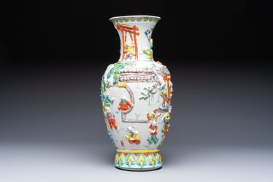 A Chinese famille verte '100 Boys' vase with relief design, 20th C.
