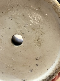 An unusual Chinese famille noire vase with relief design, Kangxi mark, 19th C.