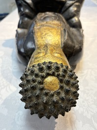A large Chinese gilt-lacquered bronze Buddha, 17th C.