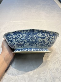 Four Chinese blue, white and famille rose tazzas and a covered spice bowl with bats design, 19th C.