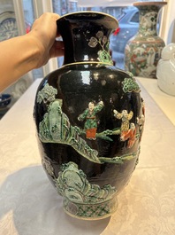 An unusual Chinese famille noire vase with relief design, Kangxi mark, 19th C.