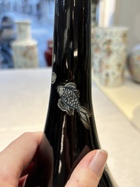 A Chinese black-glazed reverse-decorated bottle vase, 20th C.