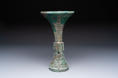 A Chinese archaic bronze wine vessel with Taotie design, Gu 觚, Shang