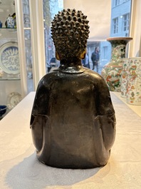 A large Chinese gilt-lacquered bronze Buddha, 17th C.