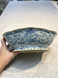 Four Chinese blue, white and famille rose tazzas and a covered spice bowl with bats design, 19th C.