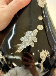 A Chinese black-glazed reverse-decorated bottle vase, 20th C.