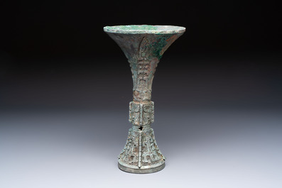 A Chinese archaic bronze wine vessel with Taotie design, Gu 觚, Shang