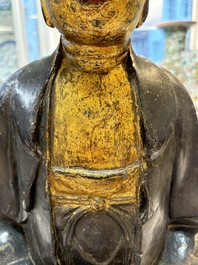 A large Chinese gilt-lacquered bronze Buddha, 17th C.