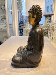 A large Chinese gilt-lacquered bronze Buddha, 17th C.