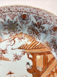 A Chinese iron-red and gilt-decorated dish with a garden scene, Kangxi