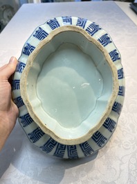 Four Chinese blue, white and famille rose tazzas and a covered spice bowl with bats design, 19th C.