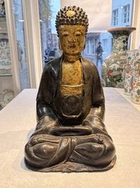 A large Chinese gilt-lacquered bronze Buddha, 17th C.