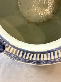 A Chinese blue and white 'Mountainous Landscape' vase with four lion-form handles, 16/17th C.