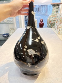 A Chinese black-glazed reverse-decorated bottle vase, 20th C.