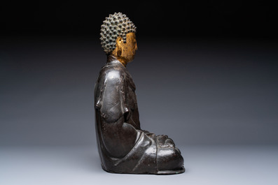 A large Chinese gilt-lacquered bronze Buddha, 17th C.