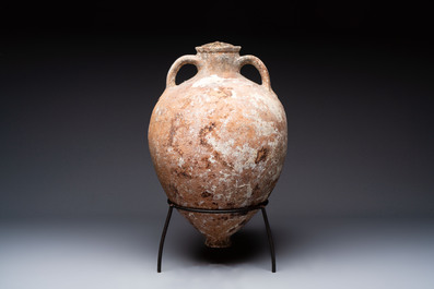 A Roman pottery olive oil transport amphora with original cover, South of Spain, 1st/3rd C.