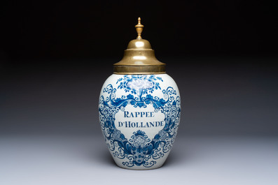 A blue and white Dutch Delft tobacco jar and a drug jar with brass lids, 18th C.