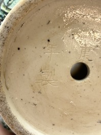 An unusual Chinese famille noire vase with relief design, Kangxi mark, 19th C.