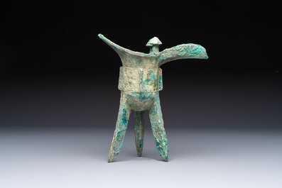 A Chinese archaic bronze wine vessel with Taotie design, Jue 爵, late Shang