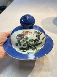 Two Chinese famille verte blue-ground vases and covers, 19th C.