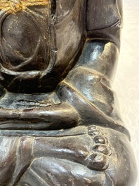 A large Chinese gilt-lacquered bronze Buddha, 17th C.