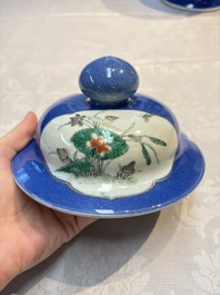 Two Chinese famille verte blue-ground vases and covers, 19th C.