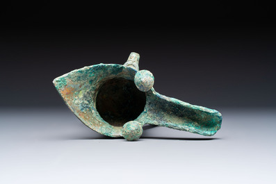 A Chinese archaic bronze wine vessel with Taotie design, Jue 爵, late Shang