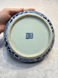 Four Chinese blue, white and famille rose tazzas and a covered spice bowl with bats design, 19th C.