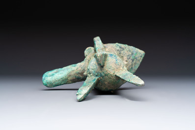 A Chinese archaic bronze wine vessel with Taotie design, Jue 爵, late Shang
