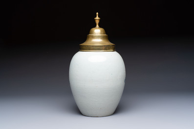 A blue and white Dutch Delft tobacco jar and a drug jar with brass lids, 18th C.