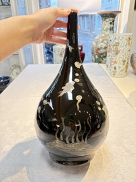 A Chinese black-glazed reverse-decorated bottle vase, 20th C.