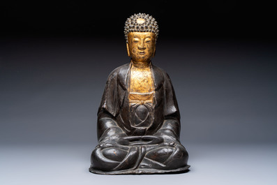 A large Chinese gilt-lacquered bronze Buddha, 17th C.