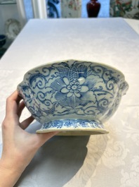 Four Chinese blue, white and famille rose tazzas and a covered spice bowl with bats design, 19th C.