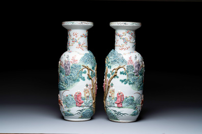 A pair of Chinese famille rose '18 Luohan' vases with relief design, 19th C.