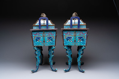 A pair of Chinese cloisonn&eacute; 'Fangding' censers and covers with Taotie design on carved wooden stands, 19th C.