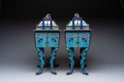 A pair of Chinese cloisonn&eacute; 'Fangding' censers and covers with Taotie design on carved wooden stands, 19th C.