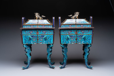 A pair of Chinese cloisonn&eacute; 'Fangding' censers and covers with Taotie design on carved wooden stands, 19th C.