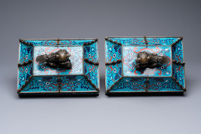 A pair of Chinese cloisonn&eacute; 'Fangding' censers and covers with Taotie design on carved wooden stands, 19th C.