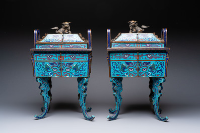 A pair of Chinese cloisonn&eacute; 'Fangding' censers and covers with Taotie design on carved wooden stands, 19th C.