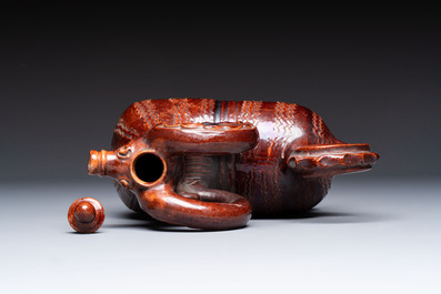 A brown-glazed stoneware ewer and cover in the shape of a ram, impressed mark, Opishne, Ukraine, early 20th C.