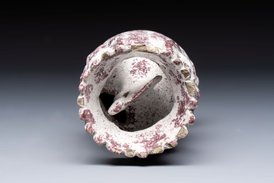 A continental manganese- and white-splashed pottery money bank, 18/19th C.